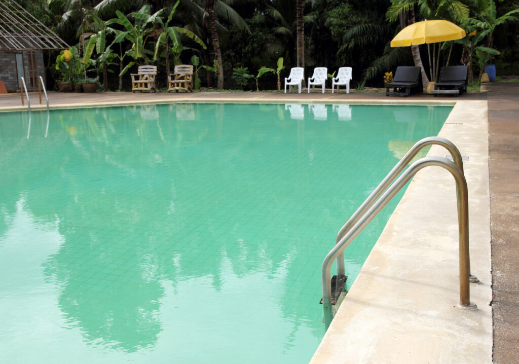 Why Is My Pool Green Even Though the Chlorine Is High? A pool can remain green even when chlorine levels are high if the chlorine is not working effectively. Common causes include high pH, excessive cyanuric acid (CYA), elevated phosphate levels that support algae growth, or inadequate filtration. In Georgetown and surrounding communities, identifying the underlying issue is essential to restoring clear pool water. [INSERT YOUTUBE URL HERE] Why a Pool Can Stay Green Despite High Chlorine Levels Seeing a green pool after testing high chlorine levels can be frustrating. While chlorine is designed to sanitize pool water and help control algae, it must be able to work effectively to produce the desired results. If other water chemistry issues or equipment problems are present, chlorine may not be able to eliminate algae, even when test results show that chlorine levels are high. Instead of assuming more chlorine is needed, it is often more helpful to evaluate the overall condition of the pool. Water balance, filtration, and contaminants all play important roles in maintaining clear water. For pool owners in Georgetown, TX and throughout Central Texas, understanding what may be limiting chlorine's effectiveness can help identify the source of persistent green water. Common Reasons Chlorine Is Not Working Effectively Several underlying issues can prevent chlorine from doing its job properly. Identifying the correct cause is important before attempting additional treatments. High pH Levels When pool water has a high pH, chlorine becomes less effective as a sanitizer. Even if chlorine levels appear adequate during testing, the disinfecting power of the chlorine is reduced. As a result, algae may continue growing despite the presence of chlorine. Maintaining balanced water chemistry helps chlorine perform as intended and supports overall water clarity. Excess Cyanuric Acid (CYA) Cyanuric acid, often called a stabilizer or conditioner, helps protect chlorine from being broken down by sunlight. However, excessive CYA can reduce chlorine's ability to sanitize pool water efficiently. When stabilizer levels become too high, chlorine may remain present in the water but become less effective against algae and other contaminants. High Phosphate Levels Phosphates act as a food source for algae. Even with elevated chlorine levels, excessive phosphates can create conditions that encourage algae growth. Reducing phosphate levels while maintaining balanced water chemistry may help improve water quality and make algae easier to control. Inadequate Filtration A pool's filtration system is responsible for removing suspended debris, dead algae, and other contaminants from the water. If the filter is dirty, clogged, undersized, or not operating long enough, algae and particles may continue circulating throughout the pool. Proper filtration works alongside balanced chemistry to help maintain clear water. Why Shock Treatment May Not Solve the Problem Many pool owners assume that shocking the pool is the automatic solution for green water. However, if the underlying issue remains unresolved, shock treatment alone may not clear the pool. For example: High pH can reduce chlorine's effectiveness. Excess cyanuric acid can limit chlorine's sanitizing ability. High phosphate levels can continue feeding algae. Poor filtration can leave algae and debris suspended in the water. In these situations, additional shock treatment may provide only temporary improvement or produce little visible change. Addressing the root cause is typically more effective than repeatedly adding chlorine. Throughout Central Texas, changing weather conditions, heavy pool use, and seasonal debris can all influence water balance, making routine monitoring an important part of pool care. How Balanced Pool Maintenance Helps Prevent Green Water Keeping pool water clear involves more than maintaining chlorine levels alone. Regular maintenance focuses on the entire system to support consistent water quality. Important maintenance practices include: Monitoring chlorine, pH, and stabilizer levels. Inspecting filtration equipment regularly. Cleaning filters as recommended. Removing debris before it affects water quality. Testing water chemistry consistently. When these factors work together, chlorine is better able to perform effectively, reducing the likelihood of persistent algae problems. Pool owners in Georgetown, TX often find that consistent maintenance helps prevent recurring water quality issues before they become more difficult to correct. FAQ Can algae grow even if chlorine levels are high? Yes. If chlorine is less effective because of high pH, excessive cyanuric acid, or other water chemistry issues, algae can continue growing despite elevated chlorine levels. Does high pH affect chlorine performance? Yes. High pH reduces chlorine's sanitizing effectiveness, making it more difficult for chlorine to eliminate algae and maintain clear pool water. Can a dirty filter keep a pool green? Yes. An inefficient or dirty filter may not remove algae and debris effectively, allowing cloudy or green water to persist even when chlorine levels appear adequate. Should I keep adding shock if my pool stays green? Not necessarily. If underlying issues such as water balance, excessive stabilizer, phosphate levels, or filtration problems remain unresolved, additional shock treatment alone may not clear the pool. FAQ: [ FAQ LINK PLACEHOLDER ] Conclusion A green pool with high chlorine levels often indicates that chlorine is not working as effectively as it should. High pH, excessive cyanuric acid, elevated phosphate levels, and inadequate filtration are among the most common causes that can prevent pool water from becoming clear. If your pool continues to stay green despite proper chlorine readings, Pool Doctor of Central Texas provides professional pool services, pool cleaning, pool repair, and pool maintenance throughout Georgetown, TX and the surrounding area. A professional evaluation can help identify the underlying cause and recommend the appropriate solution for restoring clean, clear water.